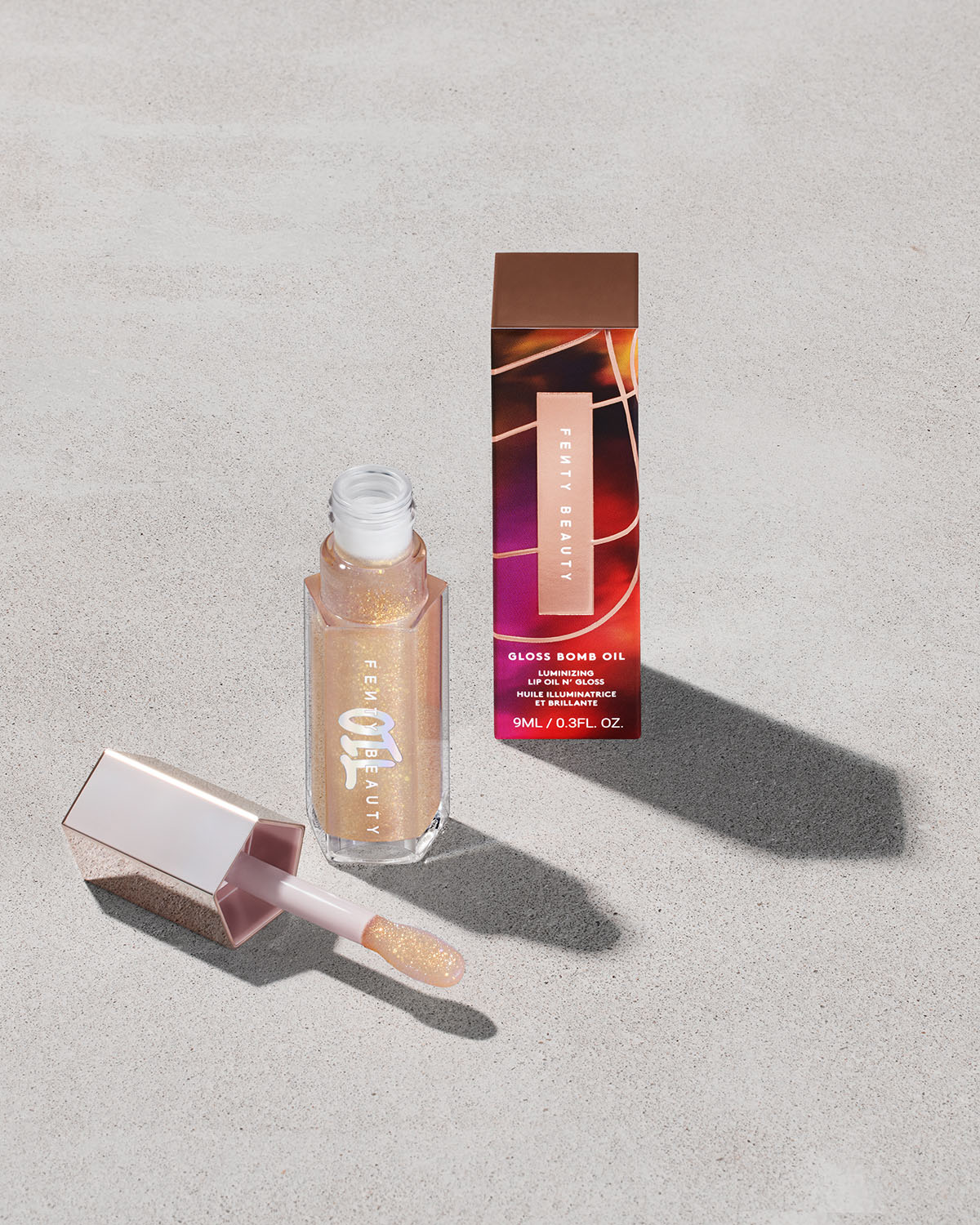 Gloss Bomb Oil Lip Gloss — Luminizing Shimmer & Shine